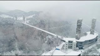 Snow Creates Winter Wonderland Scenery at Zhangjiajie Glass Bridge [upl. by Humfried514]